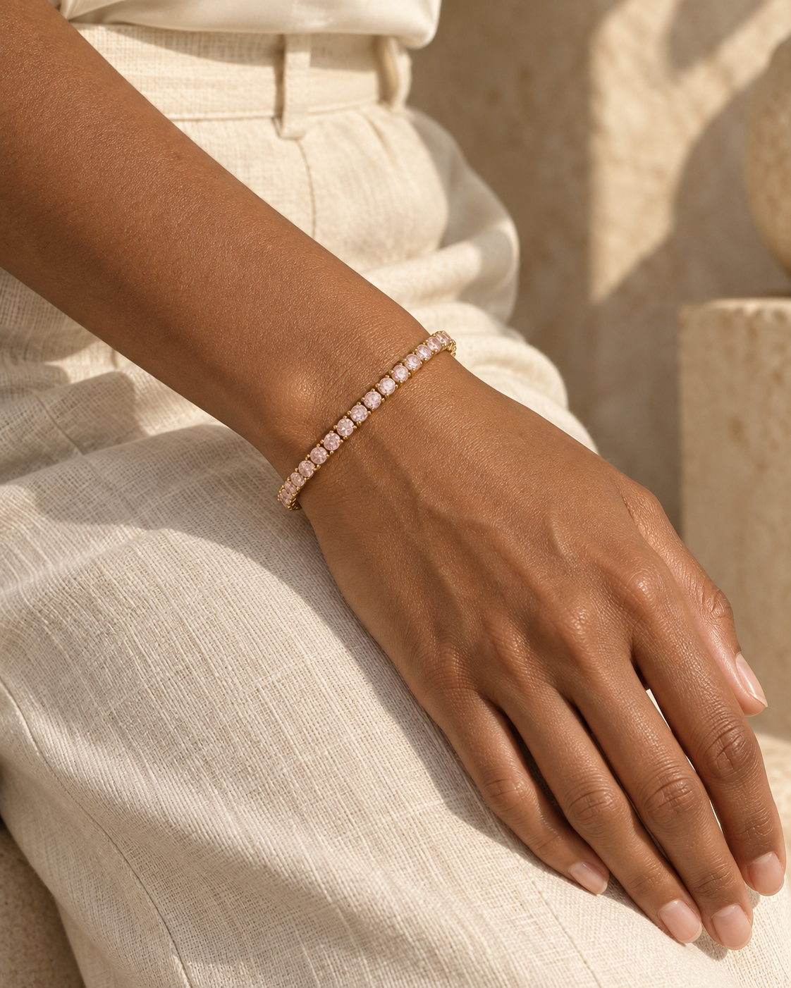 Blush Pink bracelet in yellow gold on the wrist — campaign visualization